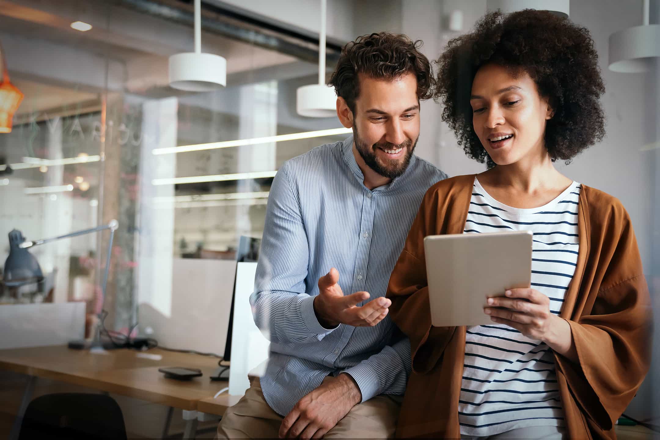 A couple looking at their ipad