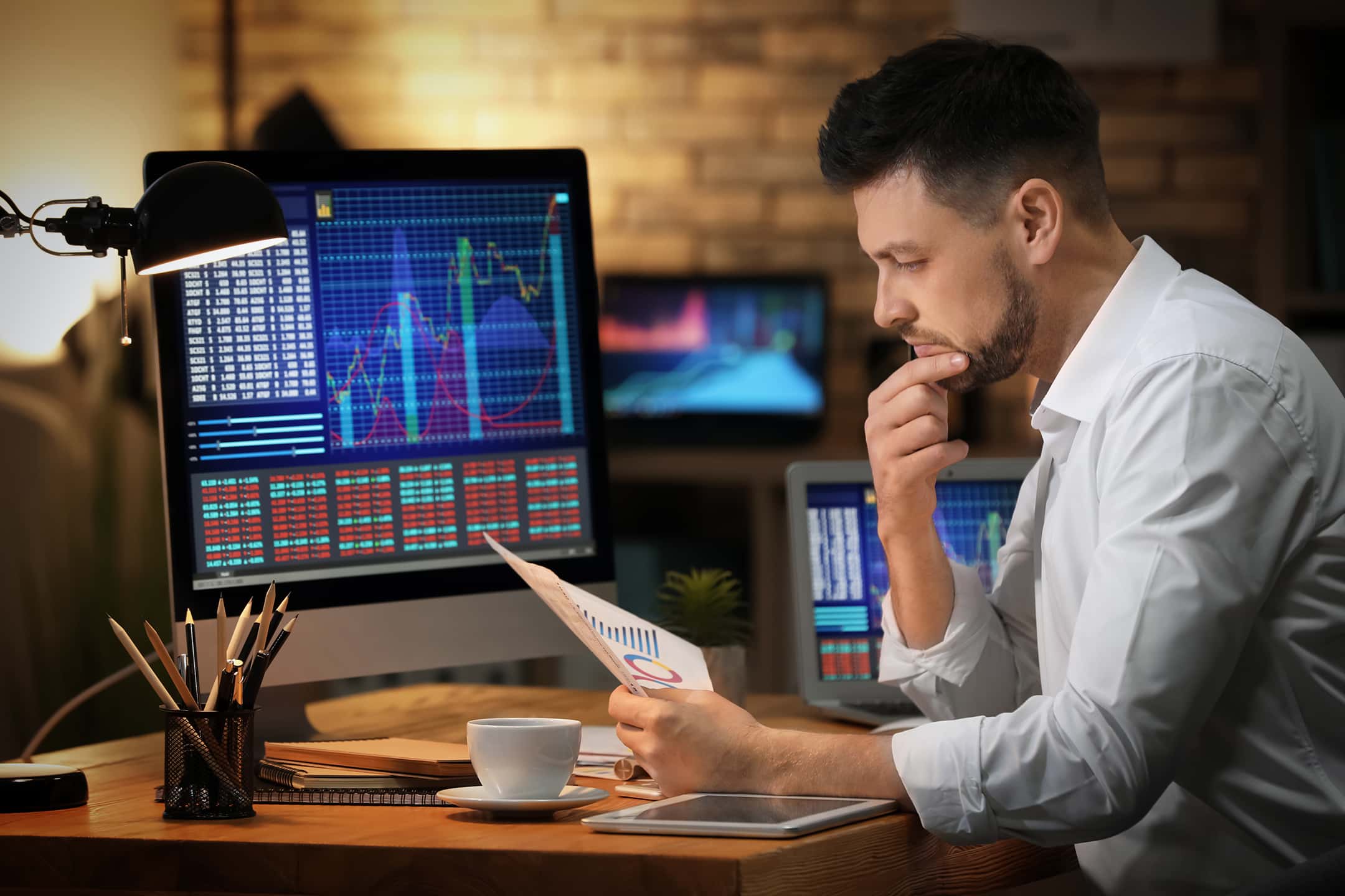A person monitoring screens in banking industry